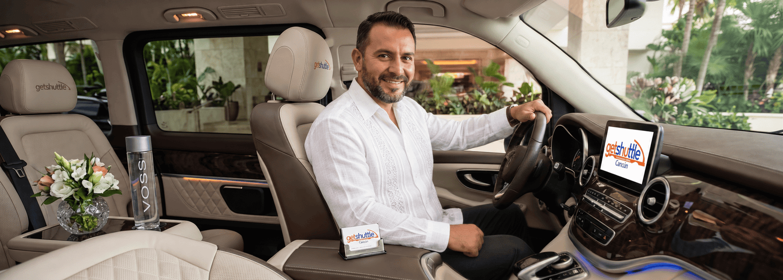 Professional private transportation driver wearing a guayabera in Cancun